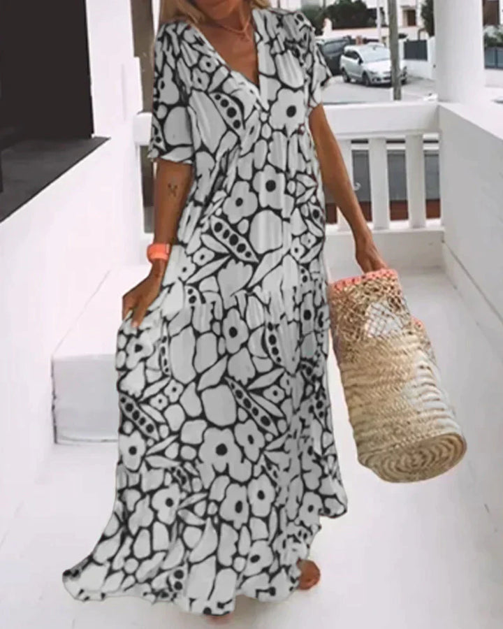 CHRISTINE | Langes Sommerkleid mit fließendem Schnitt und eleganten grafischen Mustern